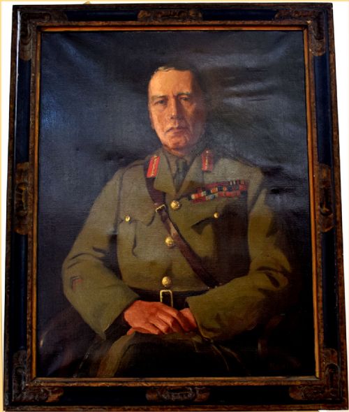 fig 1. An oil painting on canvas depicting a seated British army officer in khaki uniform with military decorations against a dark background.