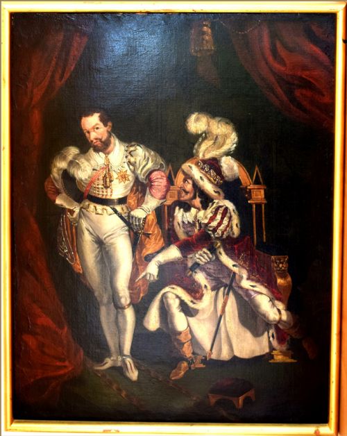 fig 3. An oil painting depicting two men in elaborate 19th-century theatrical costumes, with one seated wearing a feathered cap and the other standing in a white doublet against red drapery.