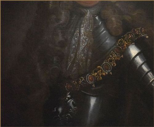 fig 2. A Baroque oil painting depicting a nobleman with a full periwig and lace cravat wearing polished steel plate armour.