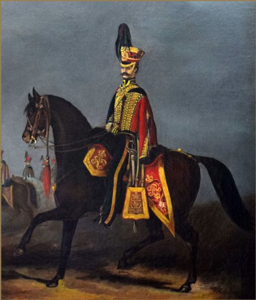 fig 3. A 19th-century oil painting depicting a military officer of the 15th Kings Hussars in red and gold uniform riding a dark brown horse.