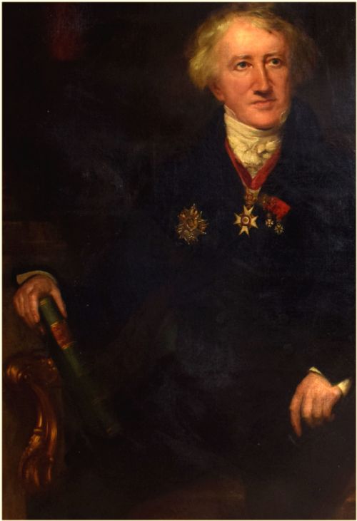 fig 2. An antique oil painting on canvas depicting a seated gentleman with white hair wearing a dark coat decorated with medals, holding a green book beside a red-draped table.