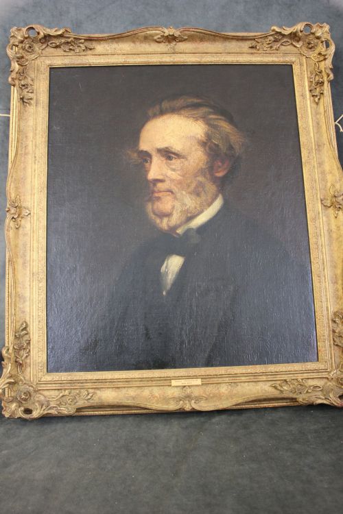 fig 2. An oil on canvas portrait painting of a nineteenth-century gentleman with grey hair and beard wearing a black jacket against a dark background.