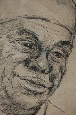 fig 1. A black charcoal portrait drawing depicting musician Louis Armstrong on warm brown paper, signed by artist Juliet Pannett in the lower right corner.