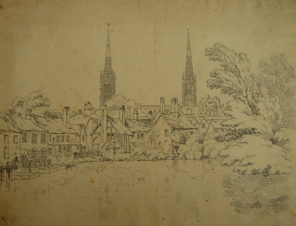 An antique monochrome graphite drawing on cream paper depicting timber-framed houses along a waterfront with two church spires in the background.