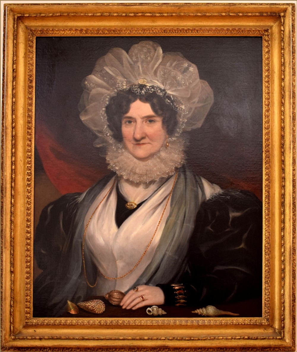 A 19th-century Victorian oil painting depicting a female conchologist wearing a white lace bonnet, pleated ruff, and gold jewellery alongside a selection of sea shells. View II