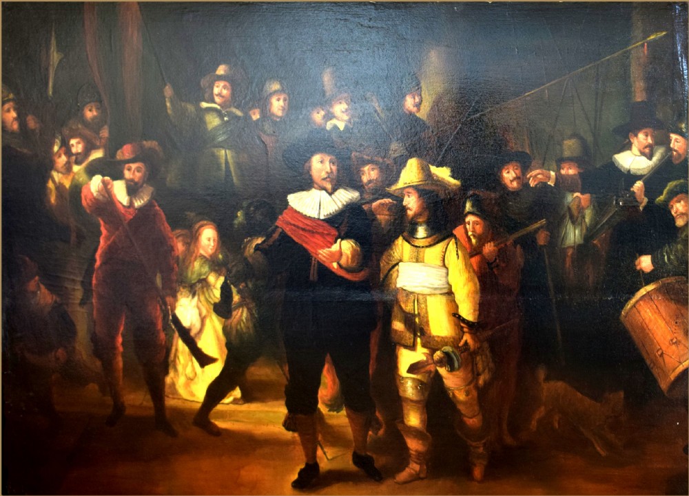 An oil painting depicting a group of seventeenth-century Dutch militia figures illuminated by dramatic lighting against a dark background.