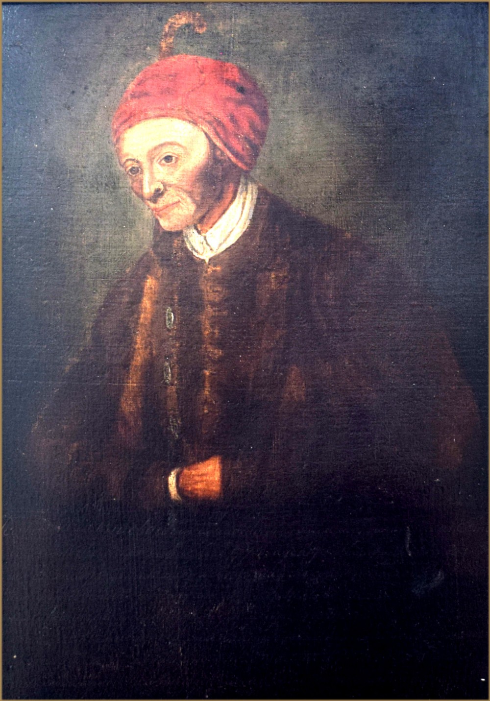 An 18th-century oil painting depicting an elderly man wearing a red cap and dark coat against a dark background.