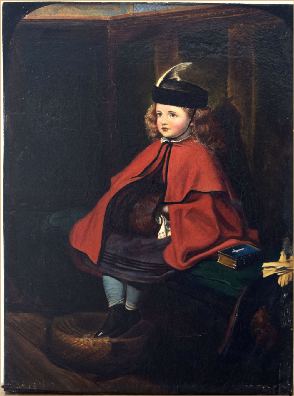 A nineteenth-century oil painting on wood panel depicting a young girl wearing a red cloak and black hat seated in a wooden church pew.