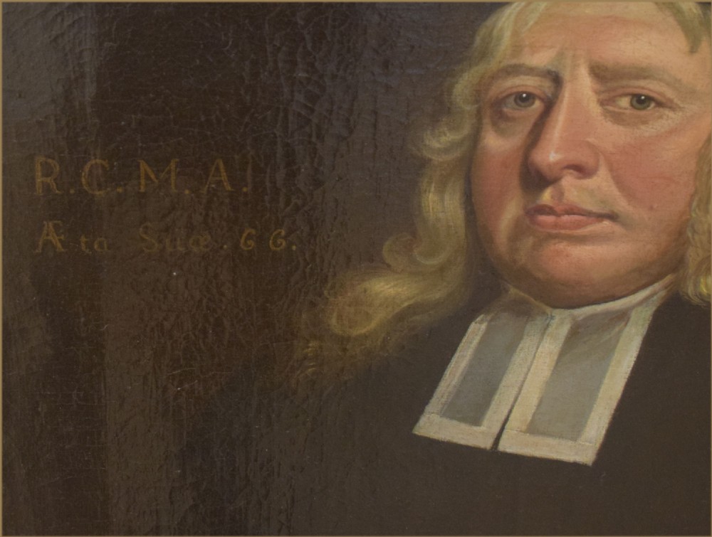 A seventeenth-century oil painting depicting a gentleman in a black gown and white collar holding a leather-bound book against a dark background. View II