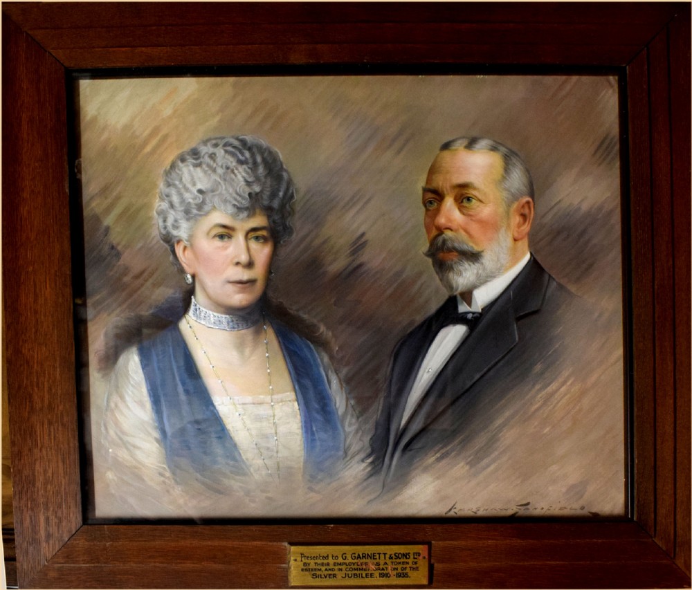 An oil painting depicting side-by-side bust portraits of Queen Mary in a blue gown with jewellery and King George V in a dark suit against a brushed neutral background. View III