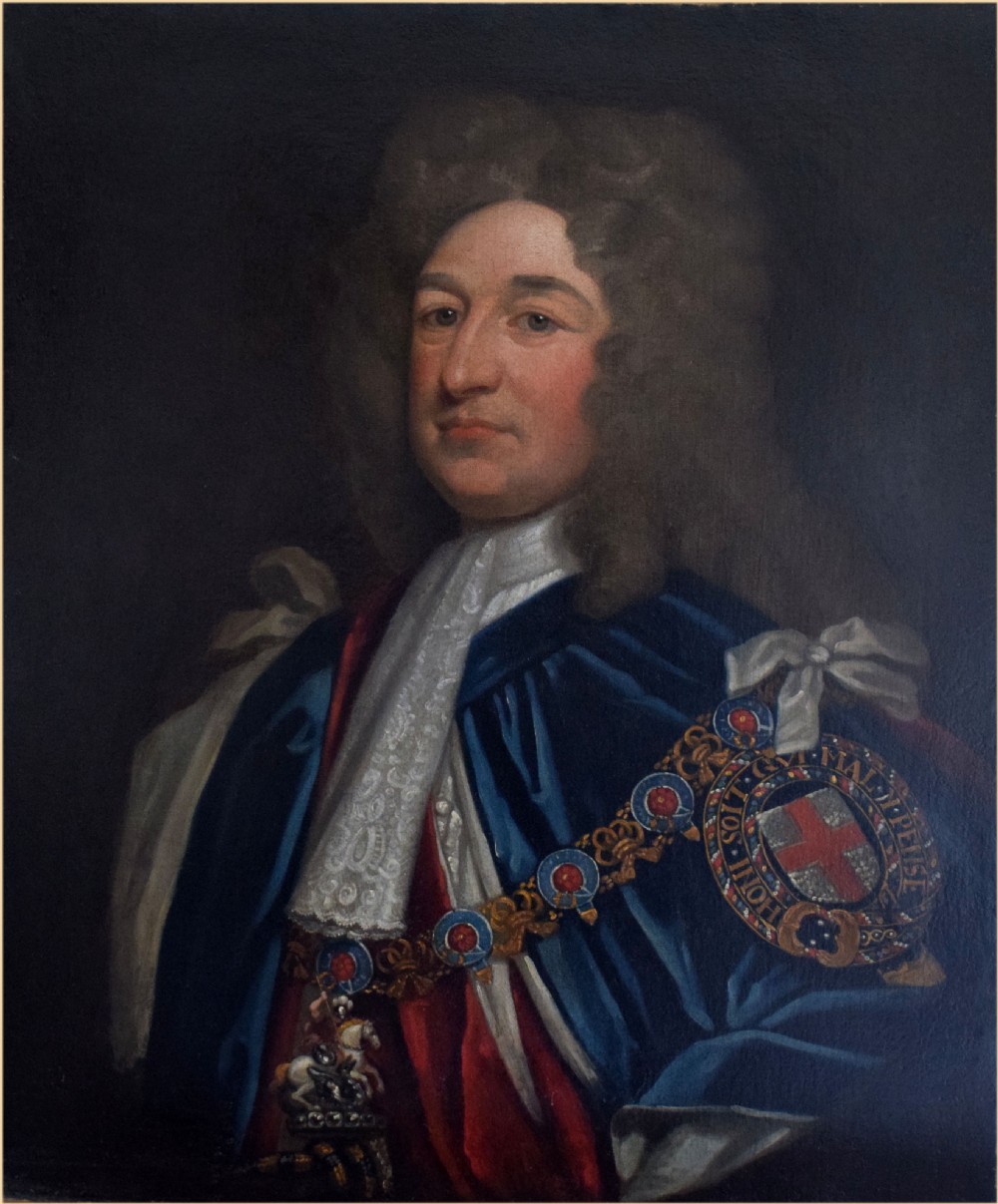 An oil portrait on canvas depicting a gentleman in a periwig wearing blue and red ceremonial Garter robes with an embroidered collar.