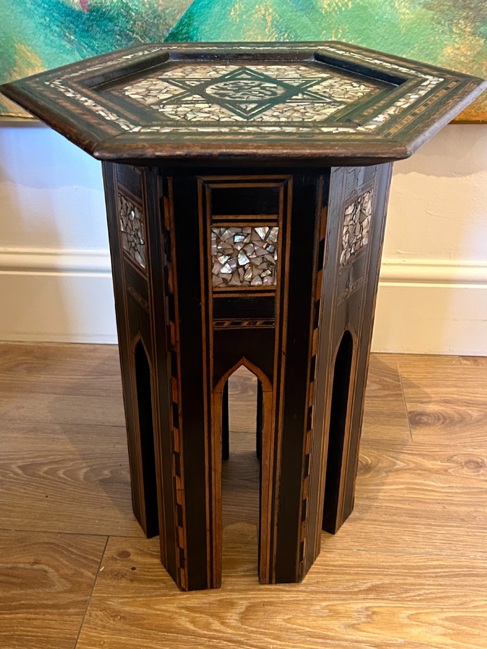 A hexagonal dark wood side table featuring intricate Mother-of-Pearl geometric inlays, a central calligraphic star motif, and arched cutout legs. View II