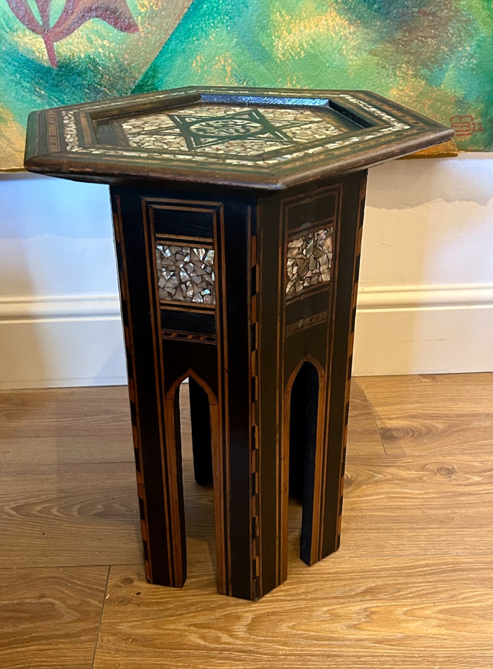 A hexagonal dark wood side table featuring intricate Mother-of-Pearl geometric inlays, a central calligraphic star motif, and arched cutout legs. View IV
