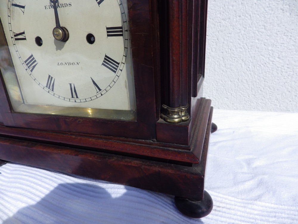 A Victorian Gothic Revival mahogany double fusee bracket clock featuring spire finials, reeded side columns, and an arched cream dial face with Roman numerals. View III