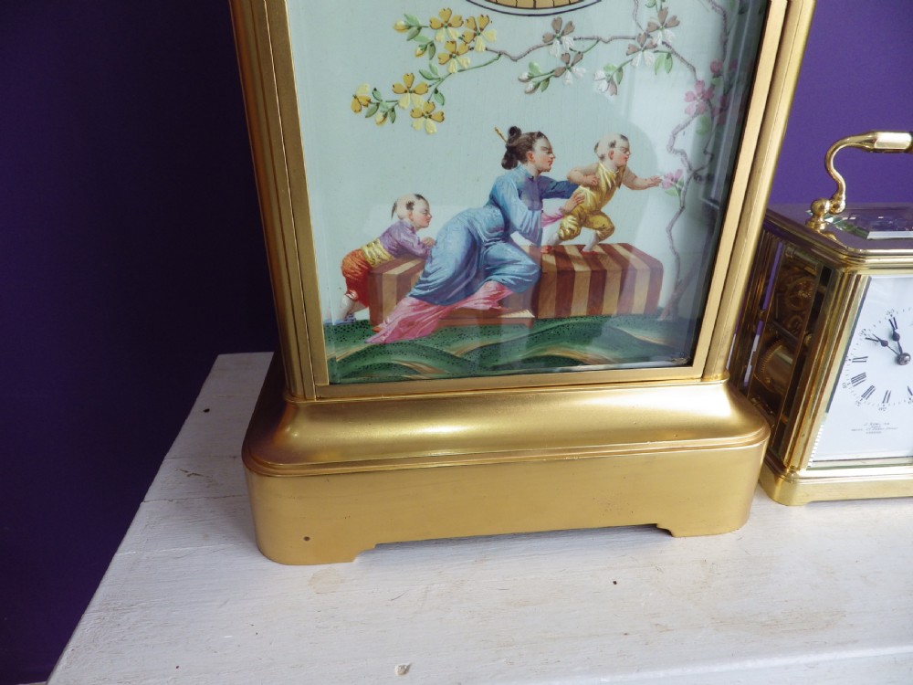 A late 19th-century French gilt brass crystal regulator clock featuring a hand-painted enamel front panel decorated with Chinoiserie figures and floral motifs. View II