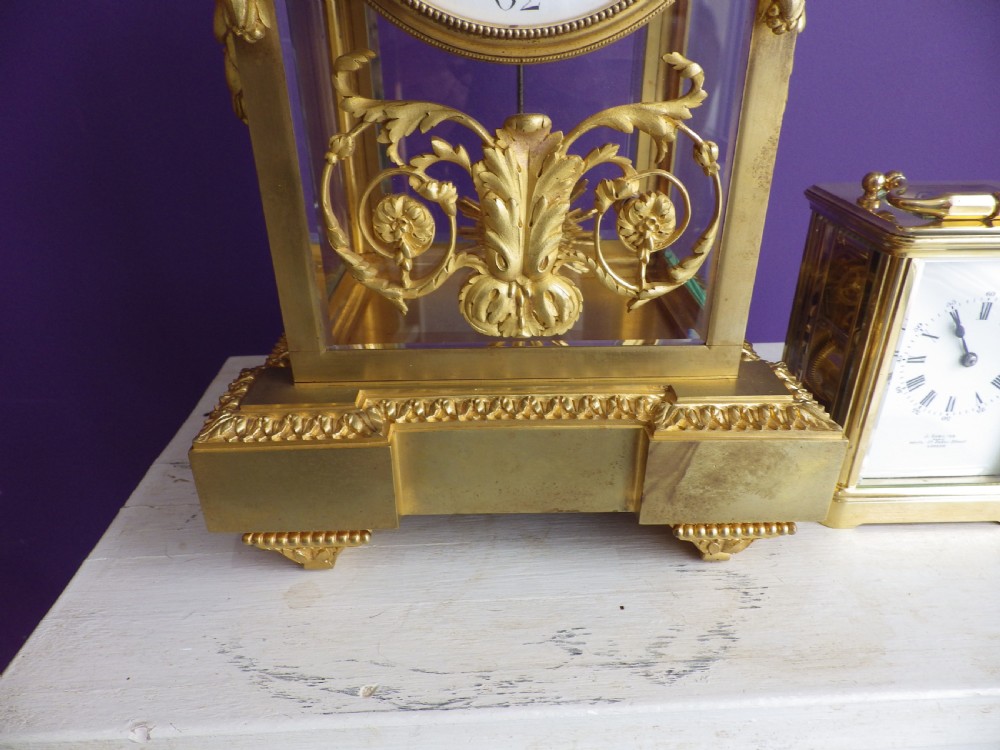 Late 19th-century French gilt bronze crystal regulator clock with bevelled glass sides, top urn finial, and white enamel dial. View II