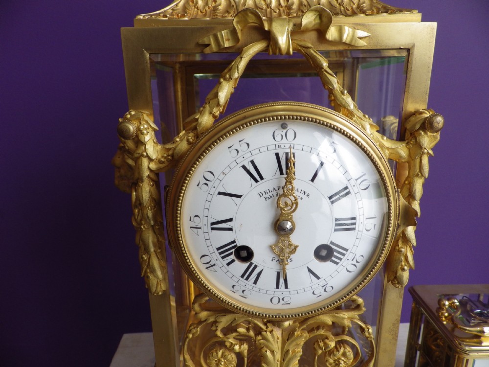 Late 19th-century French gilt bronze crystal regulator clock with bevelled glass sides, top urn finial, and white enamel dial. View III