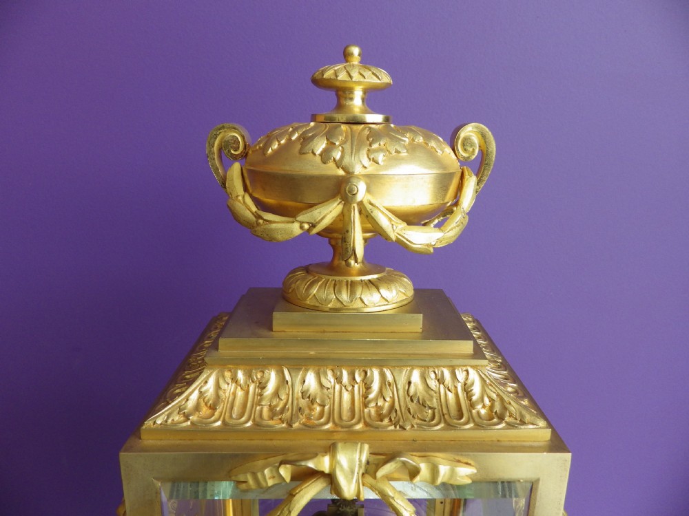 Late 19th-century French gilt bronze crystal regulator clock with bevelled glass sides, top urn finial, and white enamel dial. View IV