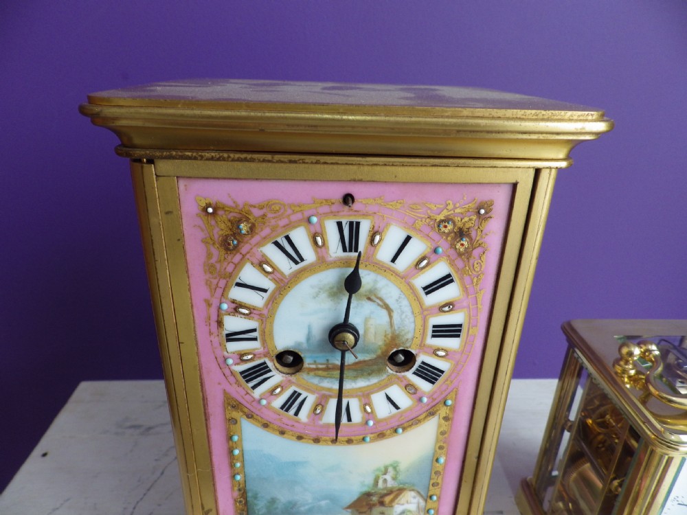 A nineteenth-century French gilt brass mantel clock featuring pink hand-painted porcelain panels depicting a landscape scene. View III