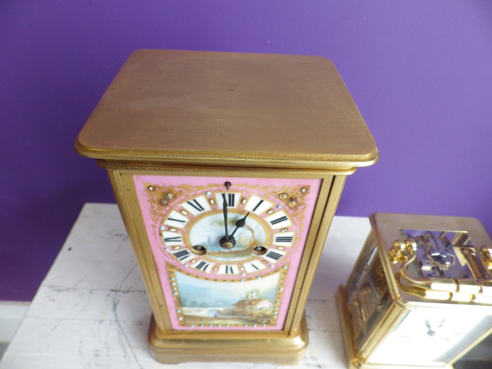A nineteenth-century French gilt brass mantel clock featuring pink hand-painted porcelain panels depicting a landscape scene. View VI