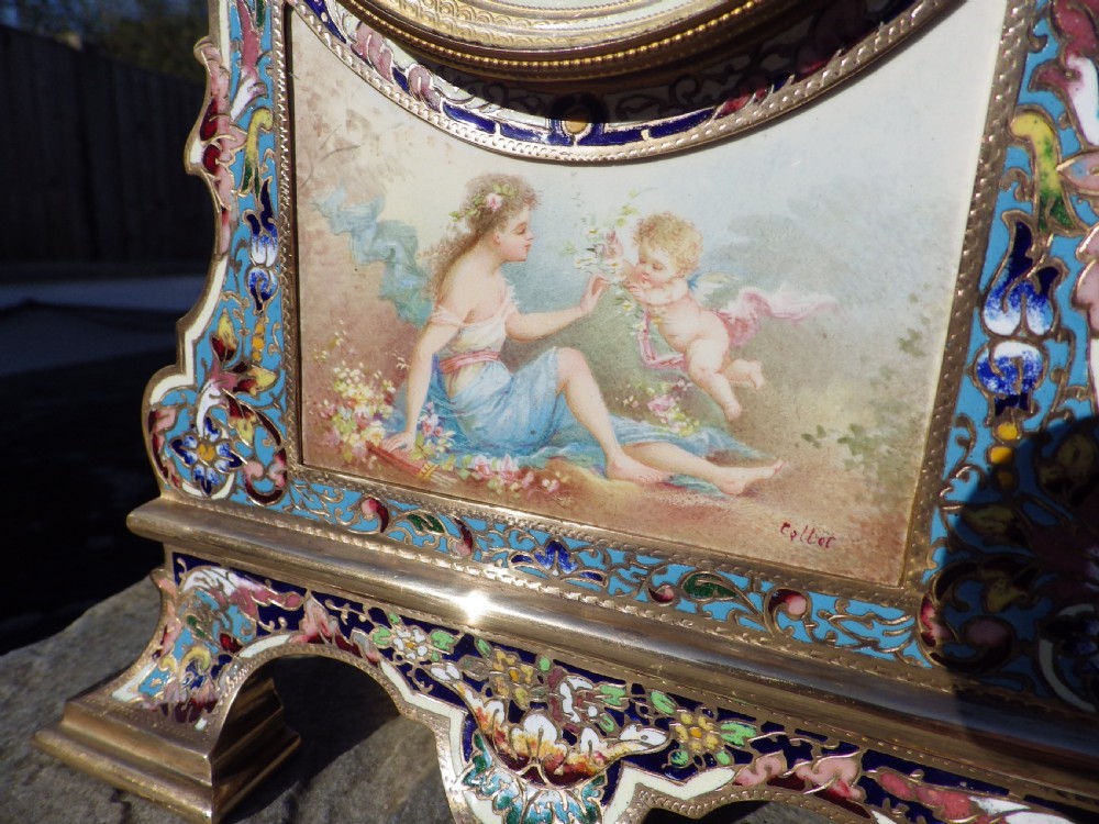 A French gilt brass mantel clock featuring intricate polychrome champleve enamel ornamentation and a hand-painted enamel panel depicting a classical figure and child. View IX