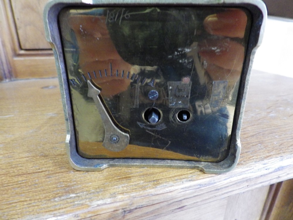 A rectangular Victorian brass carriage clock featuring a top carrying handle, glass side panels, and a white dial with black Roman numerals signed Mappin & Webb Ltd. View VII