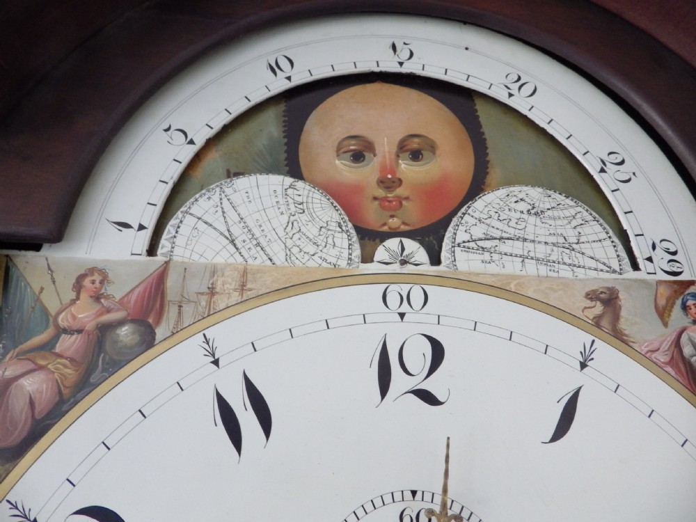 A late 18th-century Georgian mahogany longcase clock featuring a swan-neck pediment and an arched painted dial with moon phase function. View IX