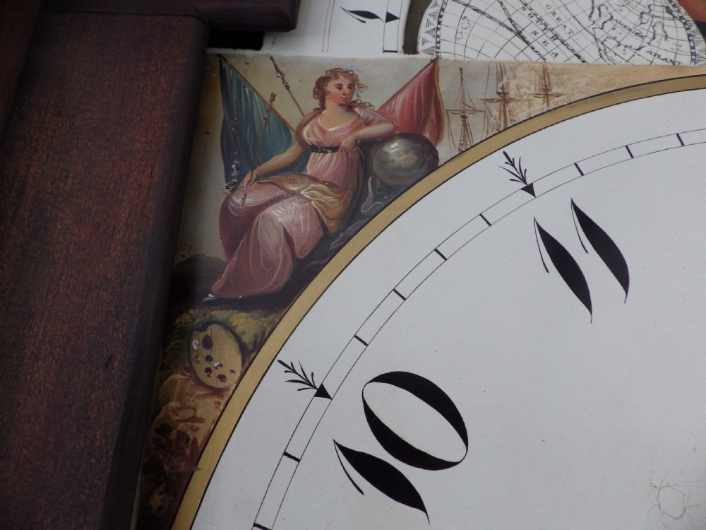 A late 18th-century Georgian mahogany longcase clock featuring a swan-neck pediment and an arched painted dial with moon phase function. View X