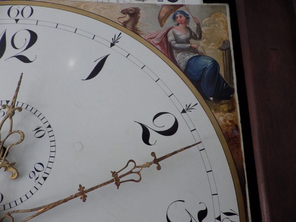 A late 18th-century Georgian mahogany longcase clock featuring a swan-neck pediment and an arched painted dial with moon phase function. View XI