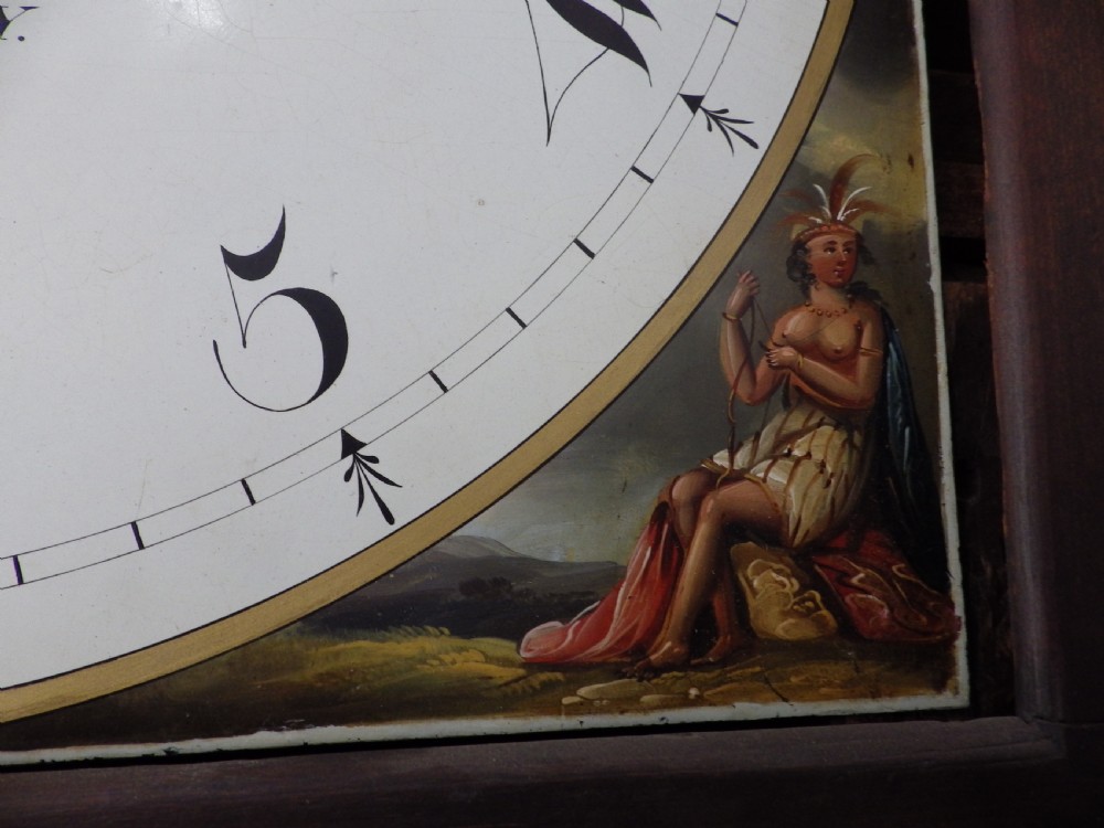 A late 18th-century Georgian mahogany longcase clock featuring a swan-neck pediment and an arched painted dial with moon phase function. View XII