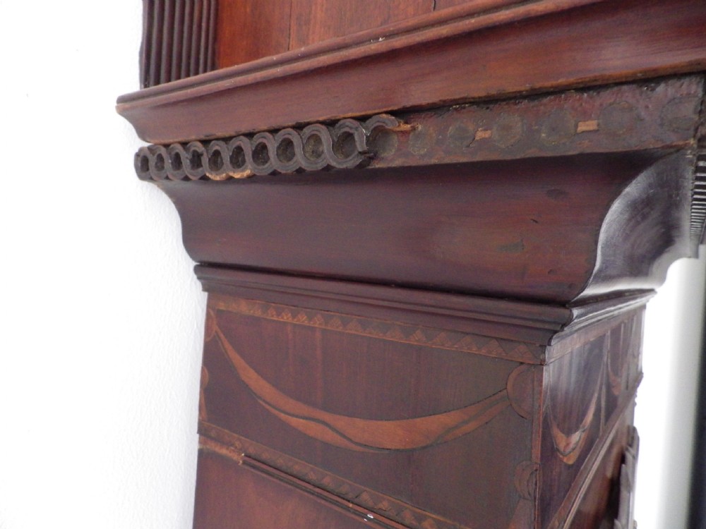 A late 18th-century Georgian mahogany longcase clock featuring a swan-neck pediment and an arched painted dial with moon phase function. View XV