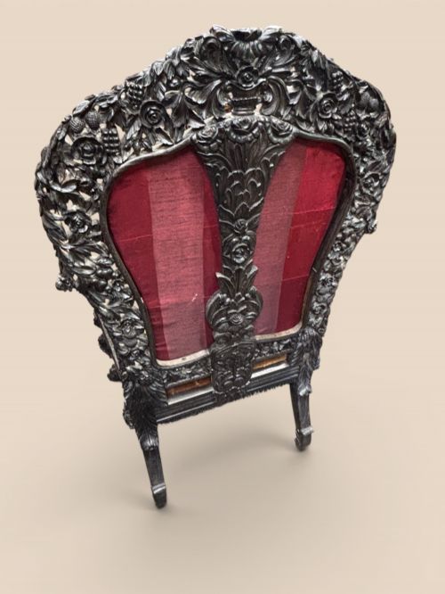 fig 2. Late 19th-century Anglo-Indian ebony side chair featuring intricate hand-carved floral backrest detailing and floral needlepoint velvet seat.