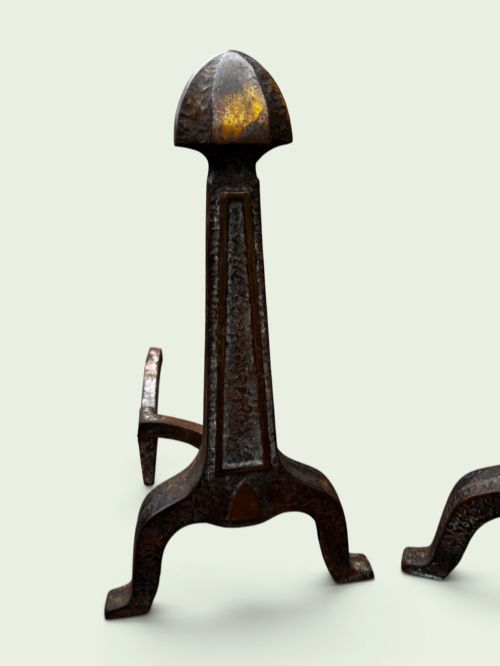 fig 1. A pair of late Victorian cast iron andirons featuring textured tapered stems and pointed finials.