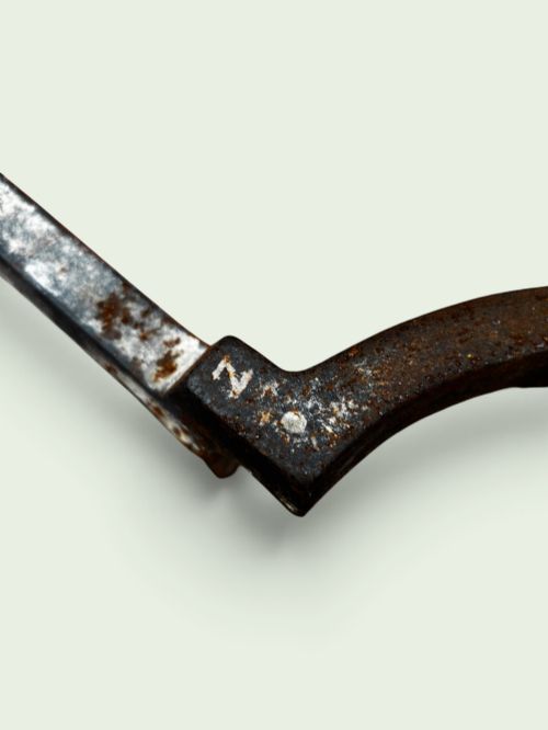 fig 2. A pair of late Victorian cast iron andirons featuring textured tapered stems and pointed finials.