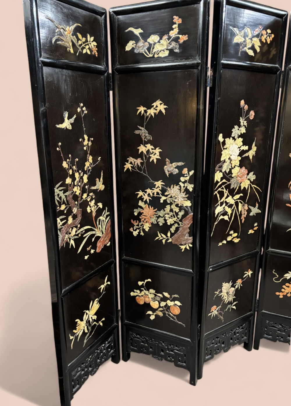 A six-panel black lacquered folding screen featuring raised stone inlays of birds and flowering branches with pierced fretwork lower panels. View III