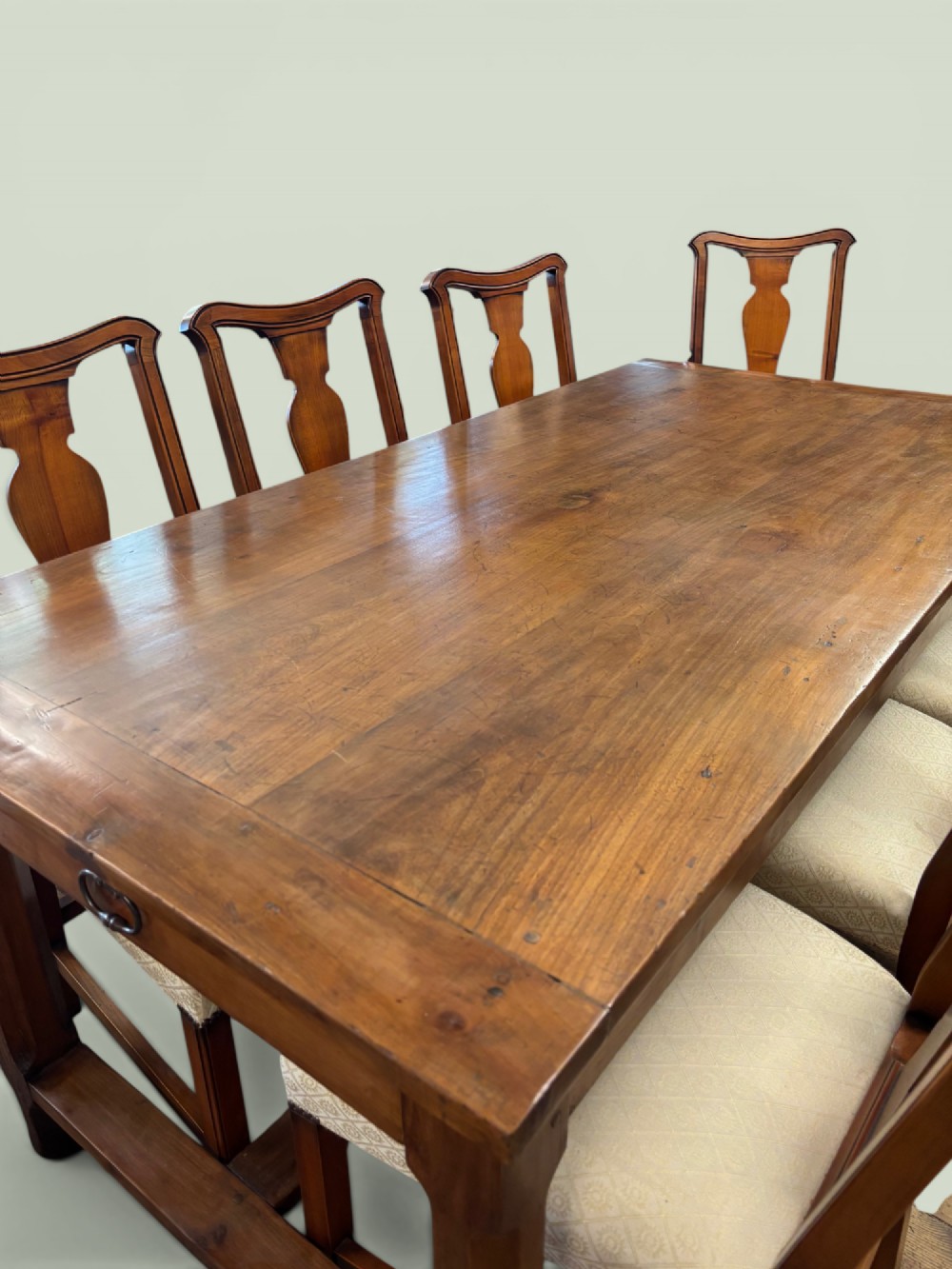 A 19th-century French cherrywood farmhouse table featuring two drawers with iron ring pulls and a sturdy H-stretcher base. View VIII