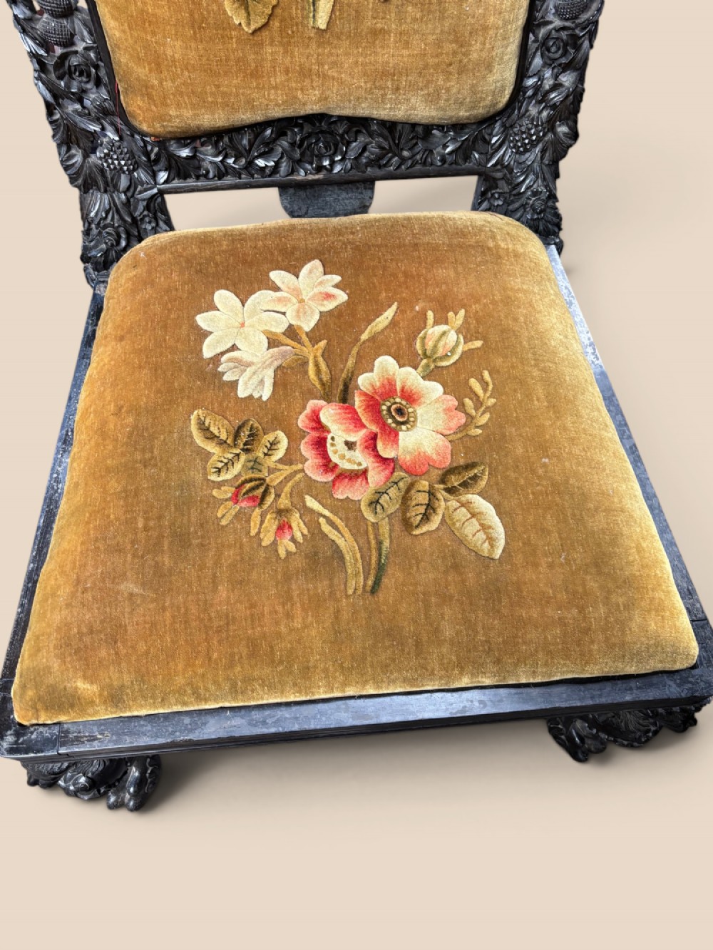 Late 19th-century Anglo-Indian ebony side chair featuring intricate hand-carved floral backrest detailing and floral needlepoint velvet seat. View IV