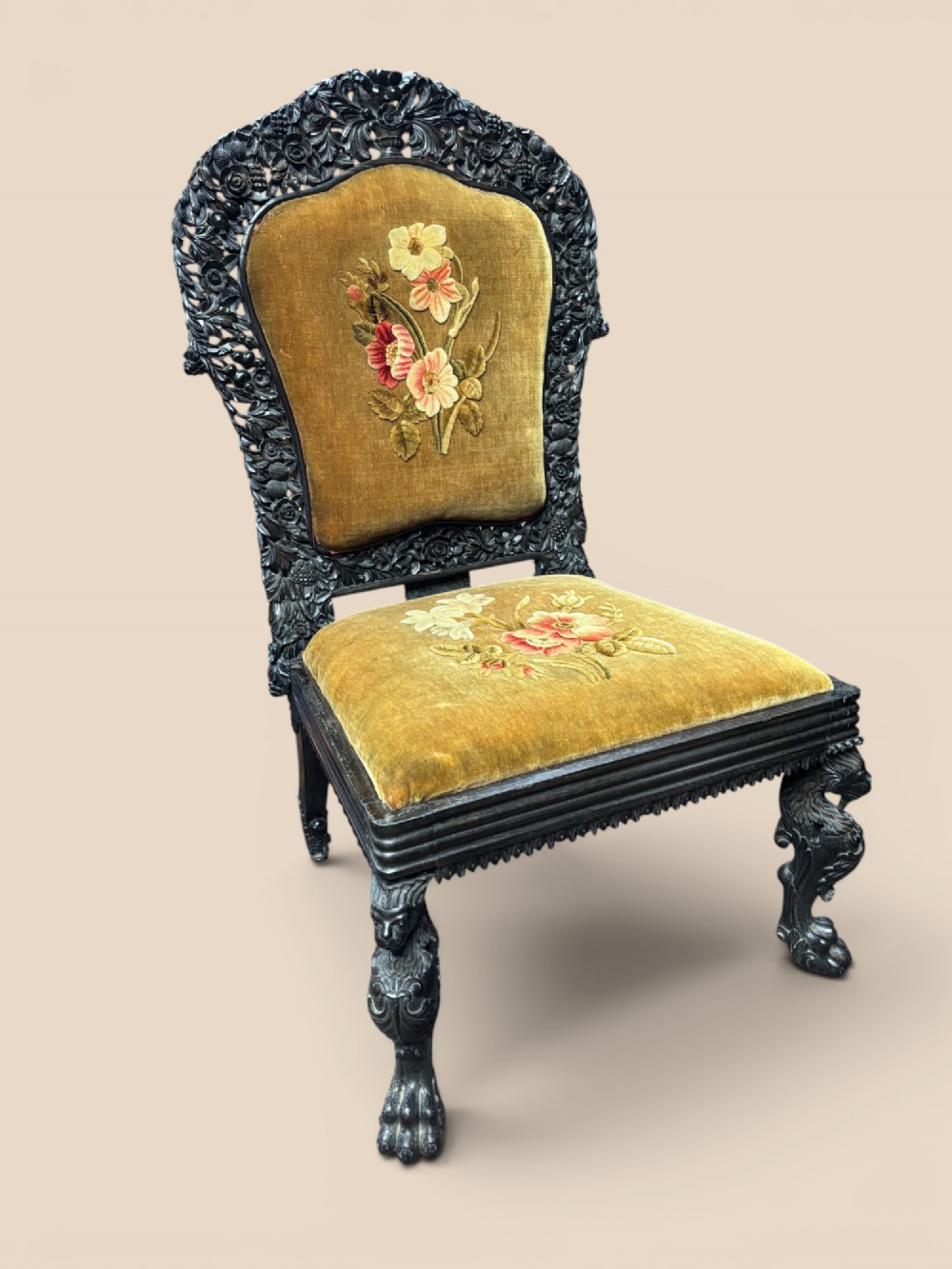Late 19th-century Anglo-Indian ebony side chair featuring intricate hand-carved floral backrest detailing and floral needlepoint velvet seat. View XI