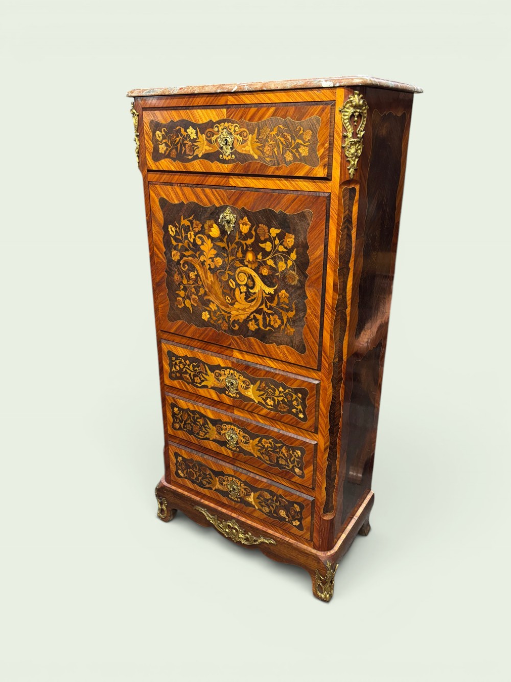 A tall French marquetry secretaire cabinet featuring floral wood inlays, gilt-bronze mounts, four drawers, and a marble top surface.