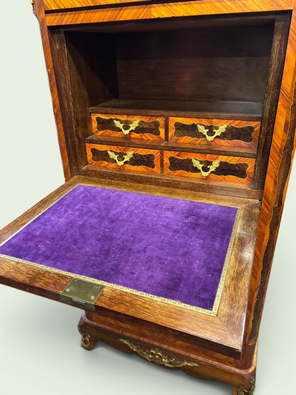 A tall French marquetry secretaire cabinet featuring floral wood inlays, gilt-bronze mounts, four drawers, and a marble top surface. View III