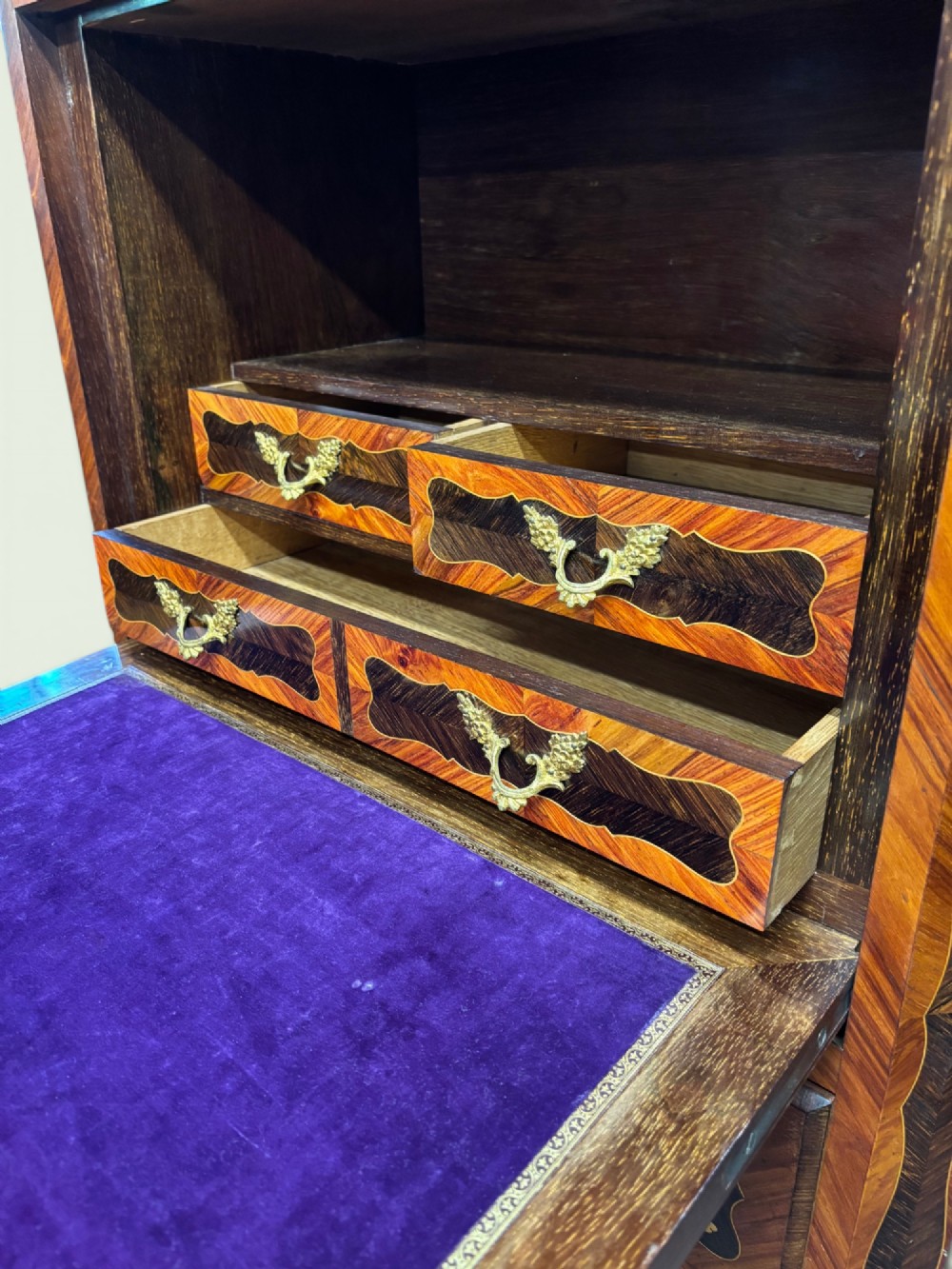 A tall French marquetry secretaire cabinet featuring floral wood inlays, gilt-bronze mounts, four drawers, and a marble top surface. View IV