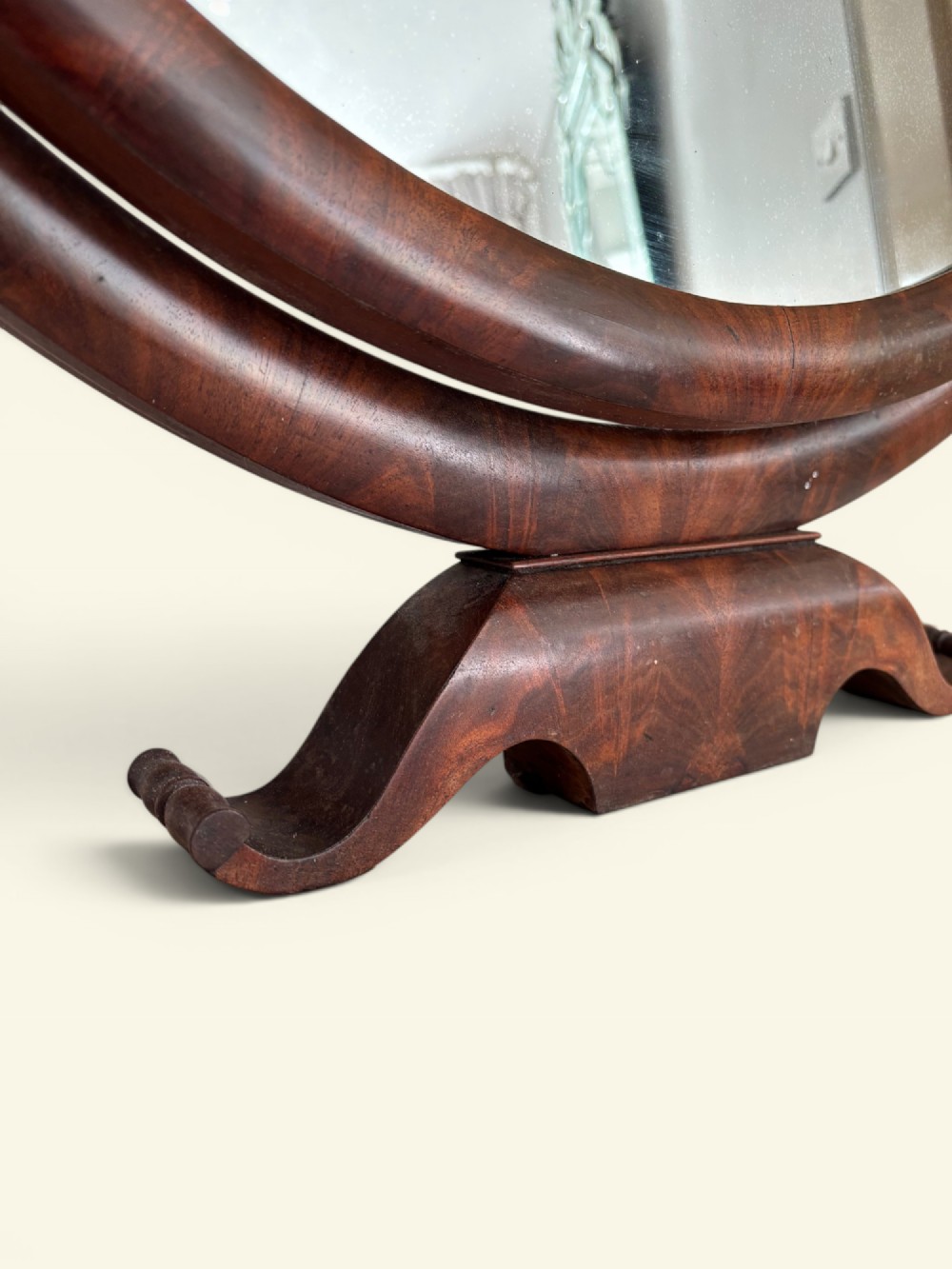 An antique dark wood dressing table featuring a swivel oval mirror, a white marble surface, S-curved legs on casters, and a central drawer. View IV
