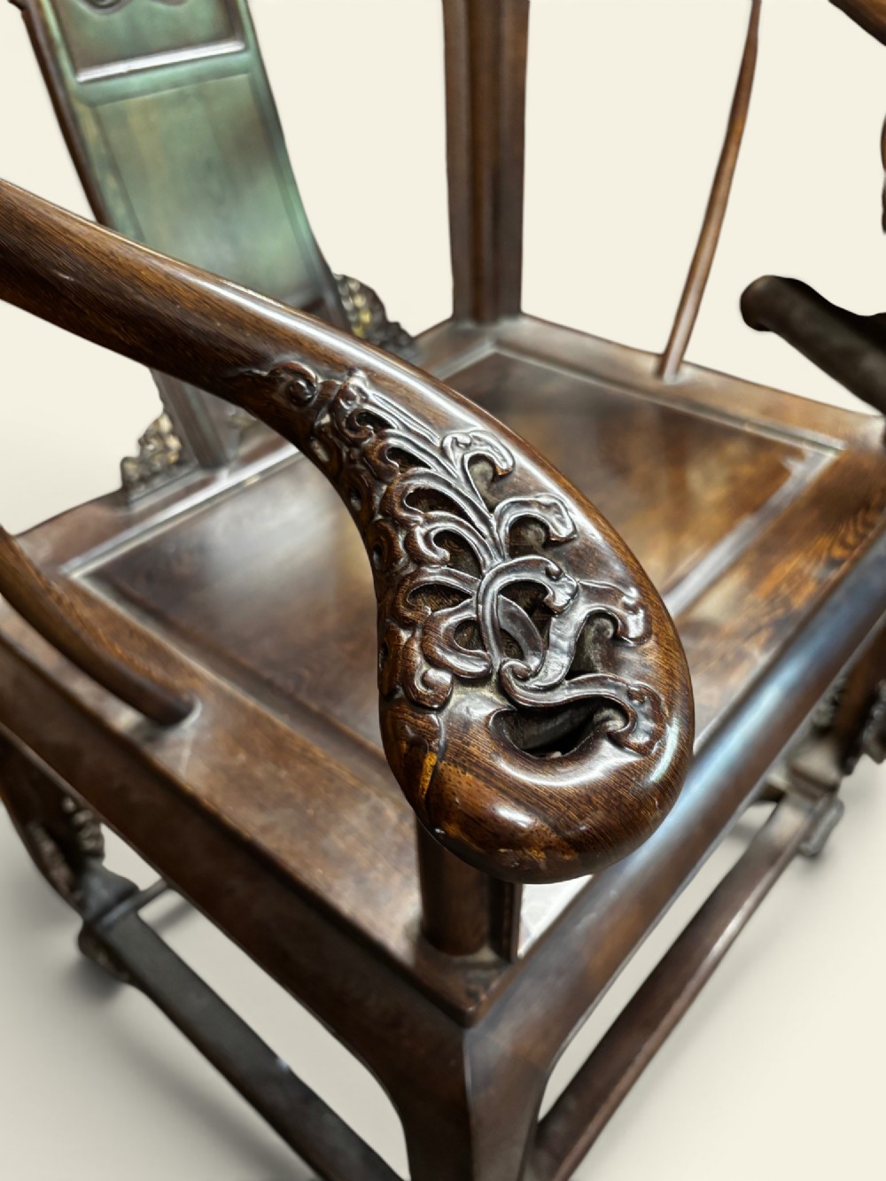 A pair of late Qing Dynasty Chinese dark hardwood horseshoe-back armchairs featuring carved back splats, sweeping crest rails, and rectangular panel seats. View III