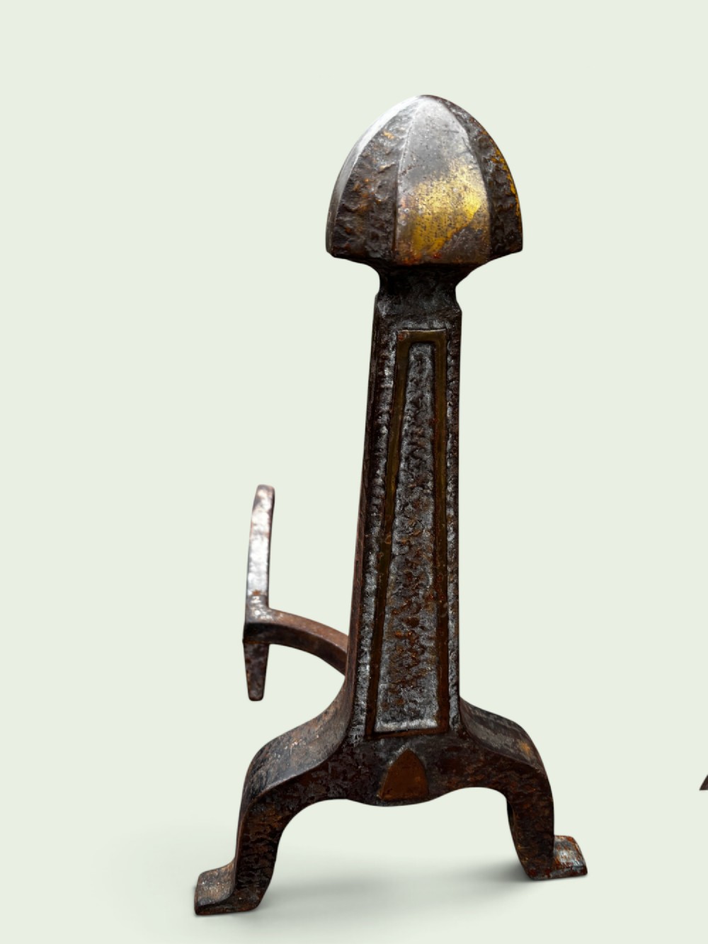 A pair of late Victorian cast iron andirons featuring textured tapered stems and pointed finials. View IV