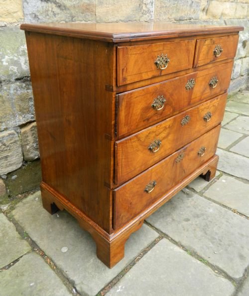 fig 1. early georgian inlaid walnut chest of drawers