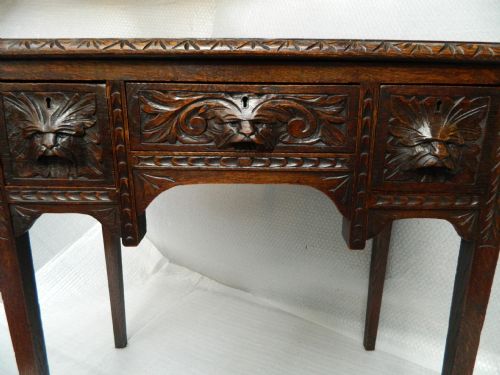 fig 1. carved oak green man table