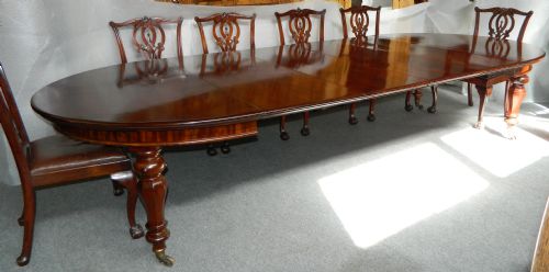 fig 1. large extending mahogany dining table with four extra leaves