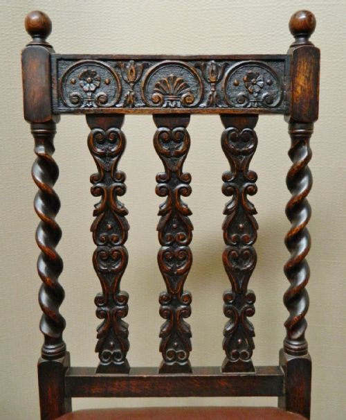fig 1. set of eight carved oak dining chairs