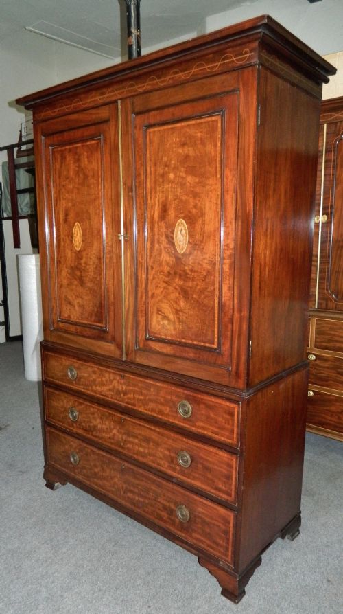 fig 1. Inlaid mahogany linen press