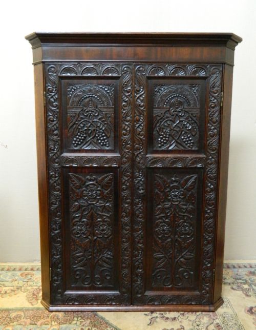 Carved Oak Corner Cupboard